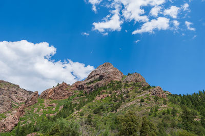 Low angle view of rocks against sky