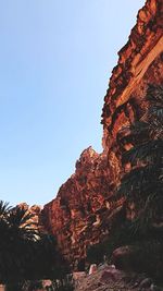 Low angle view of rock formations against sky