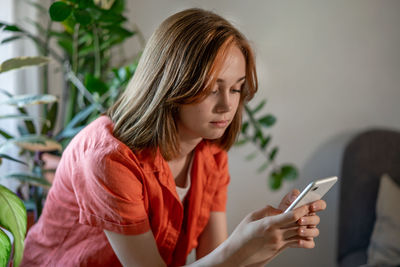 Young woman using mobile phone