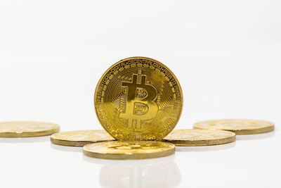 Close-up of bitcoins on white background