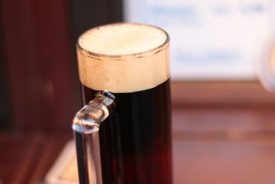 Close-up of beer glass on table