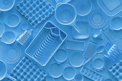 High angle view of blue kitchen utensils on table