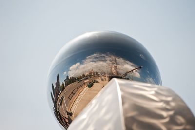 Low angle metal scupture against clear sky
