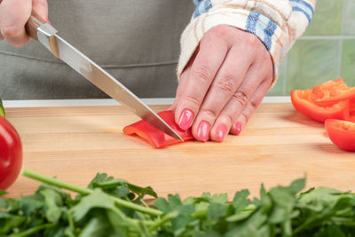 Midsection of man working on table