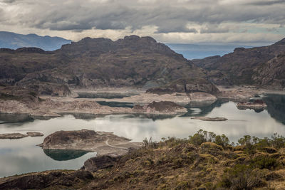 Scenic view of lake and mountains against sky