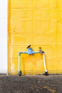 Old yellow wall against building