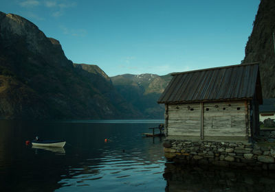 Calm lake with mountains in background