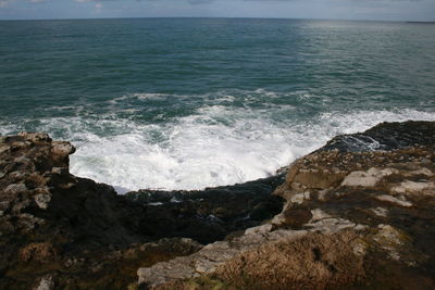 Waves splashing on rocks