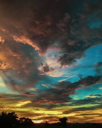 Low angle view of dramatic sky during sunset