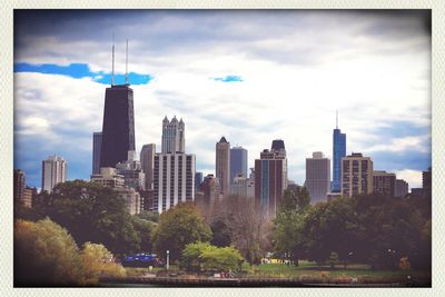 Skyscrapers in city against sky