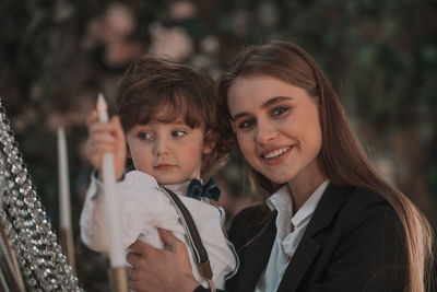 Portrait of mother and daughter outdoors