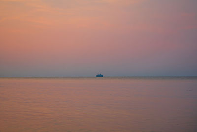Scenic view of sea against sky at sunset