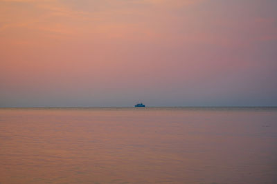 Scenic view of sea against sky at sunset