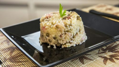 High angle view of gallo pinto in plate on table