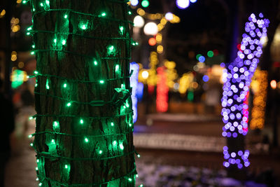 Close-up of illuminated christmas lights at night