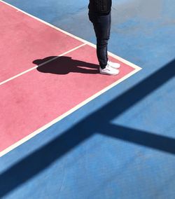 Low section of man standing on floor