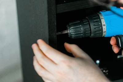 Close-up of man repairing car