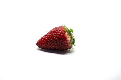 Close-up of strawberry over white background