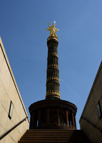 Low angle view of historical building against blue sky