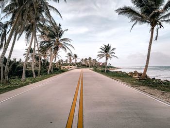 Road by sea against sky