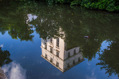 Reflection of building in puddle