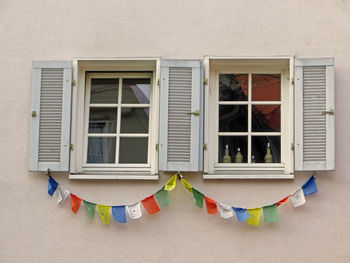 Praying flags on building windows