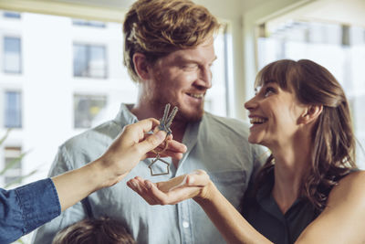 Couple receiving key to their new home