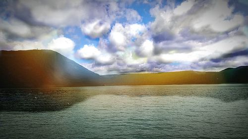 Scenic view of lake against sky during sunset