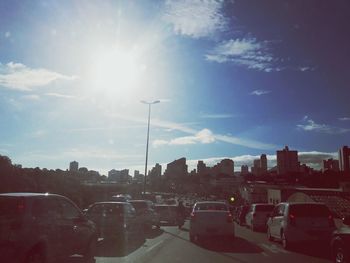 Cars on road against sky