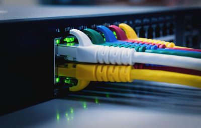Close-up of multi colored cables connected to server