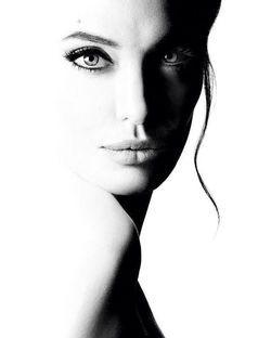 Close-up portrait of a young woman over white background