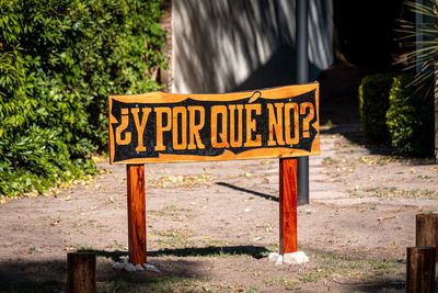 Information sign against trees