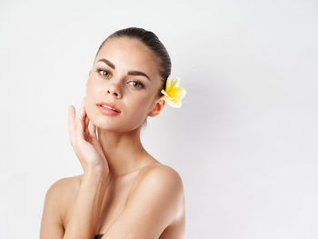 Portrait of a beautiful young woman over white background