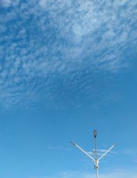 Low angle view of street light against sky