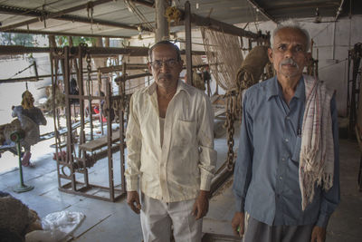 Portrait of workers standing at workshop