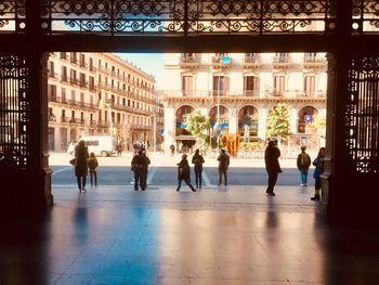 Group of people walking in front of building