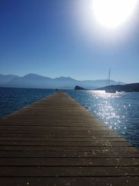 Pier over sea against clear sky