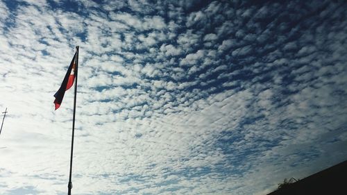 Low angle view of flag against sky