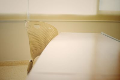 Empty chair by table in room