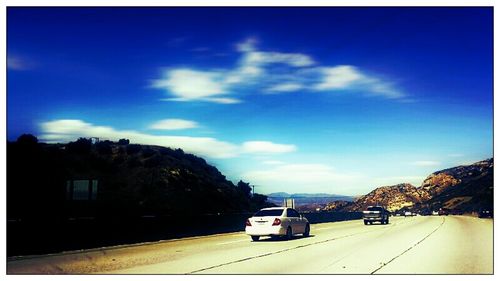 View of road against cloudy sky