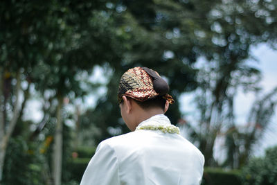 Javanese traditional wedding dress with blangkon headgear
