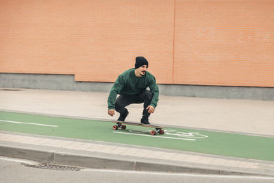 Full length of man skateboarding on skateboard