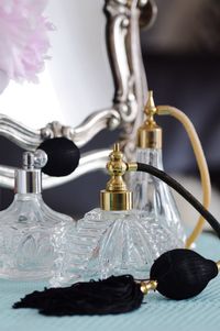 Close-up of white flower in glass bottle on table