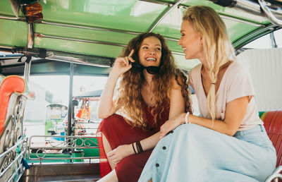 Women sitting in jinrikisha