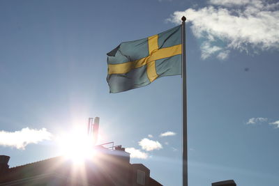 Low angle view of flag against sky