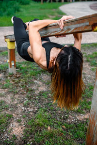 Full length of woman exercising outdoors