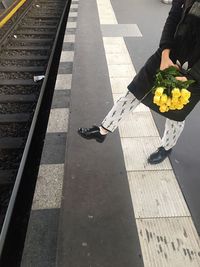 Woman with umbrella on flower