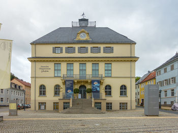 Low angle view of buildings in city against sky