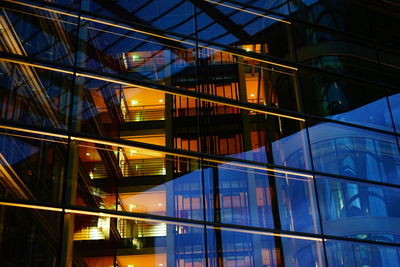 Low angle view of illuminated modern building