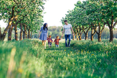 People on field against trees